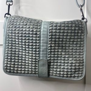 Teal genuine leather purse. Worn once. Strap length is adjustable.